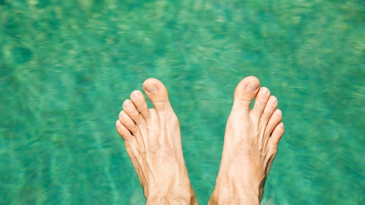 feet hovering over water