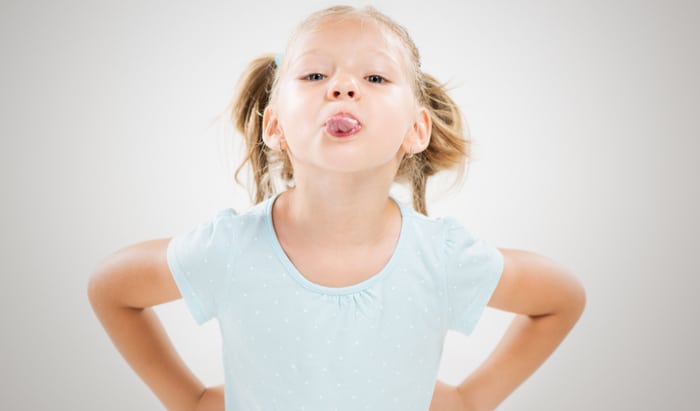 girl sticking out tongue