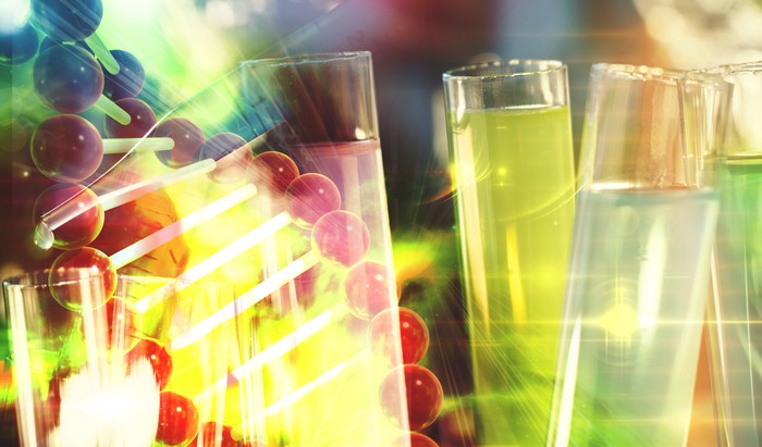 Cancer immunotherapy research concept cancer gene therapy with DNA background and test tubes